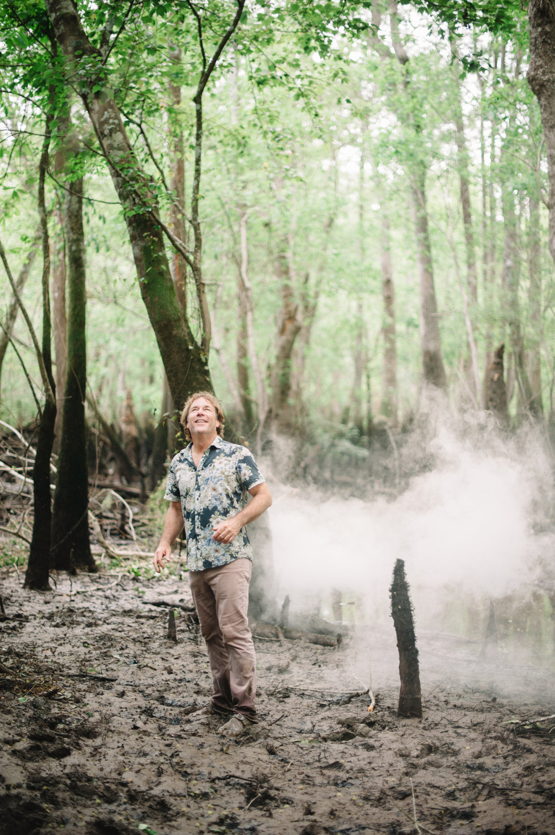 Savannah Bee Company Founder Ted Dennard standing in a tupelo grove