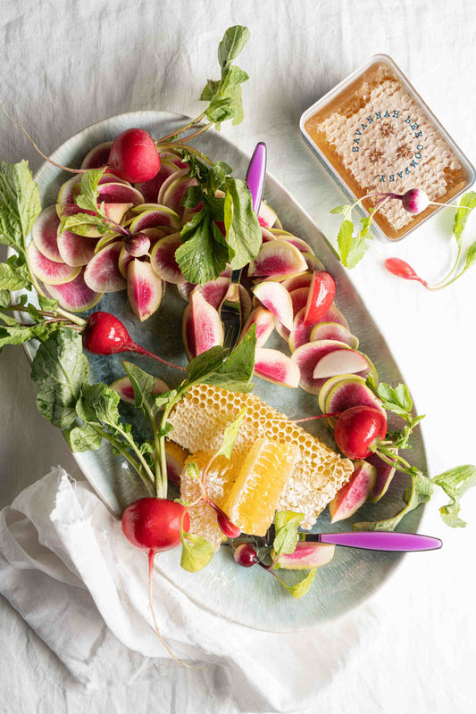 Radishes and honeycomb on a platter