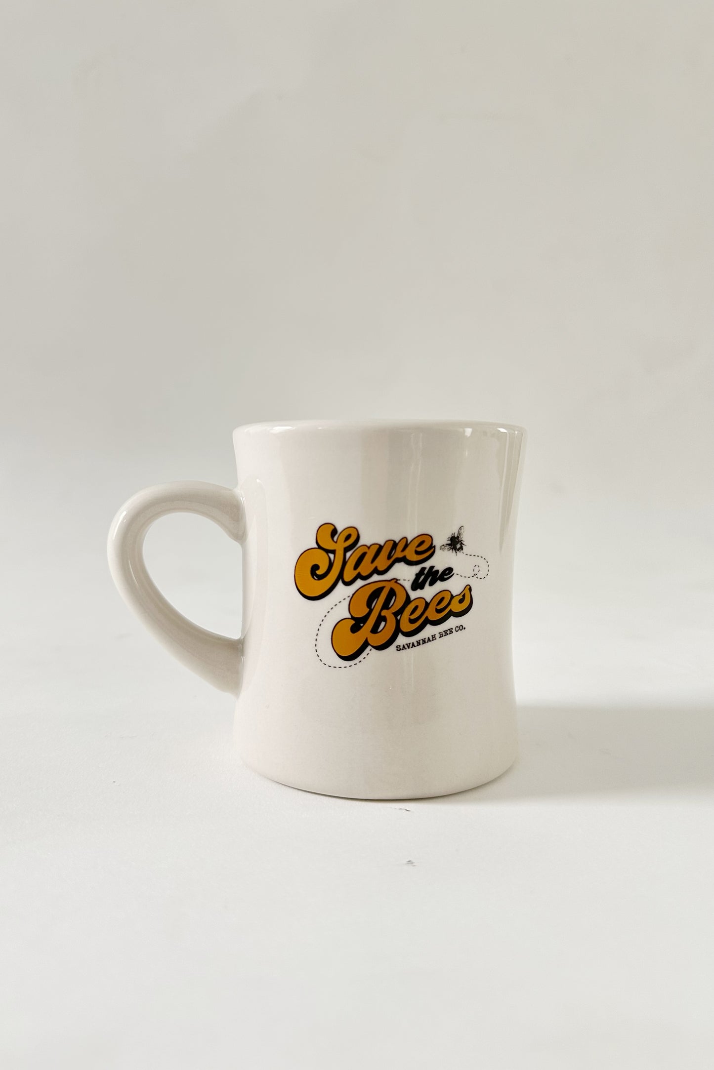 White Diner Mug with Save the Bees in yellow and brown lettering