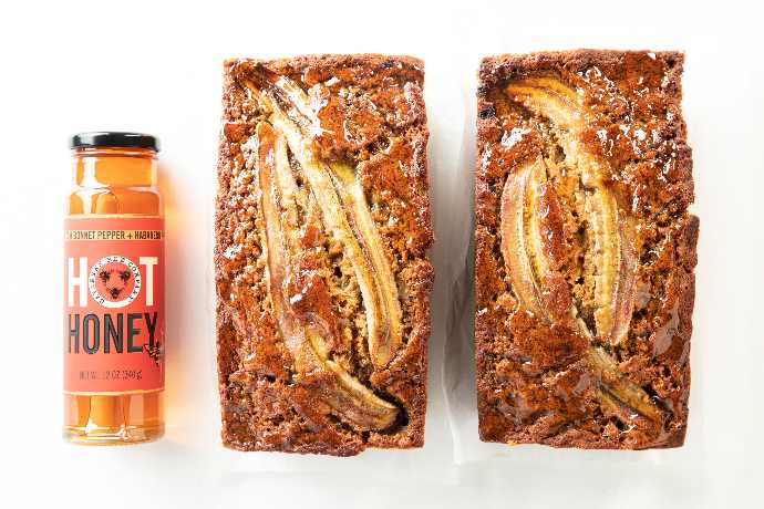 12oz Hot Honey with the red label and the O as our savannah bee logo. Featuring our hot honey banana bread using hot honey.