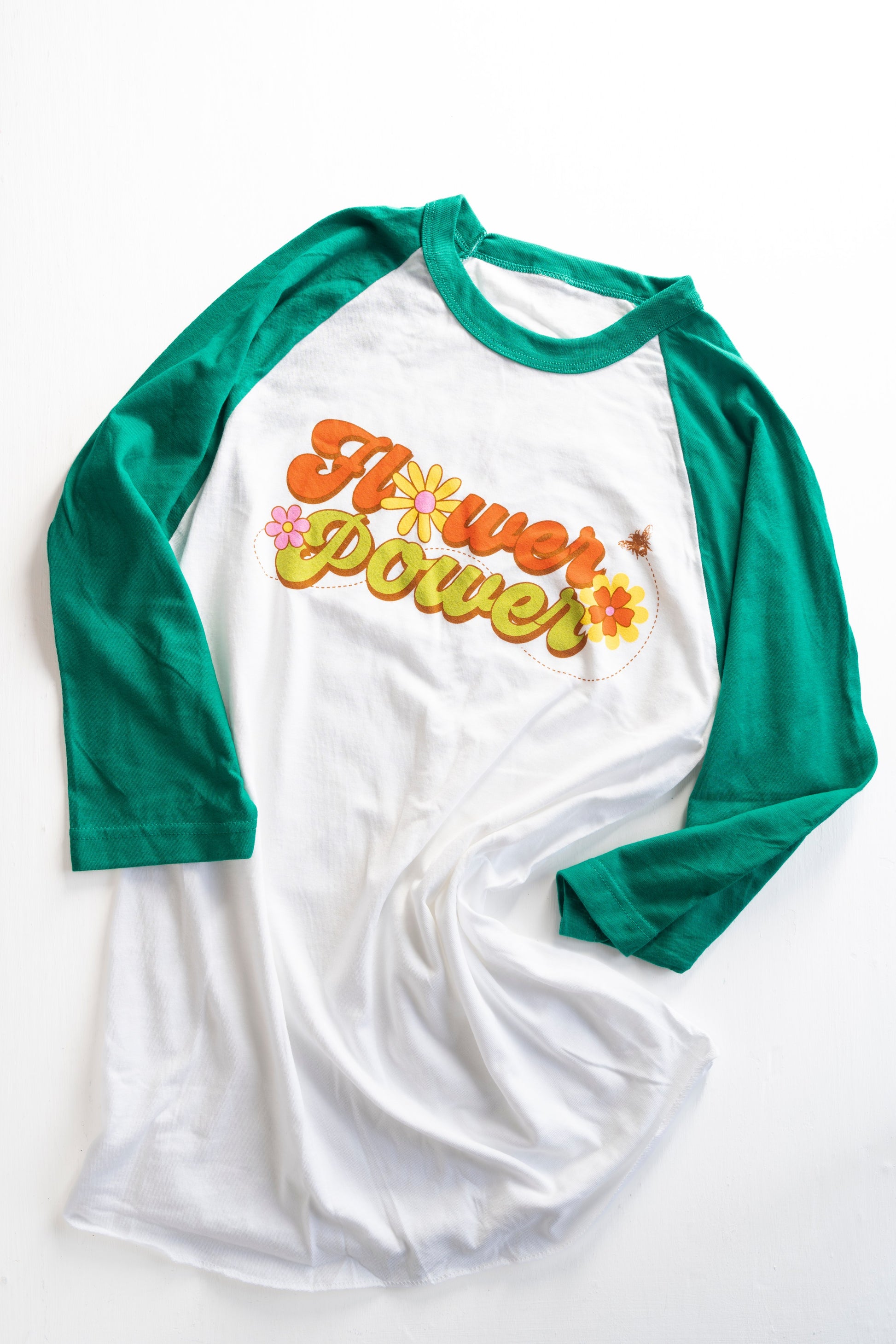 Flower power raglan tee shirt with green sleeves