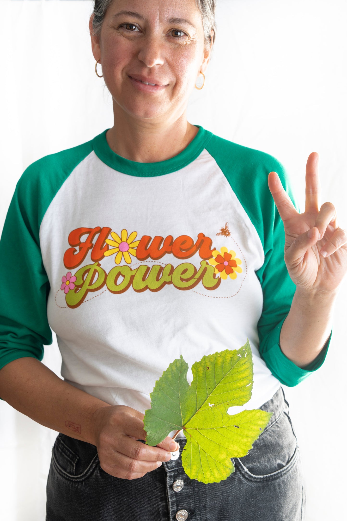 Flower power raglan tee shirt with green sleeves