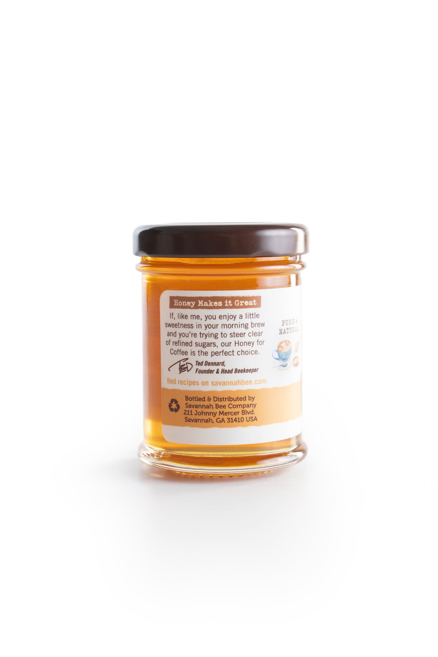 3 ounce honey for coffee in a glass jar side view on a white background