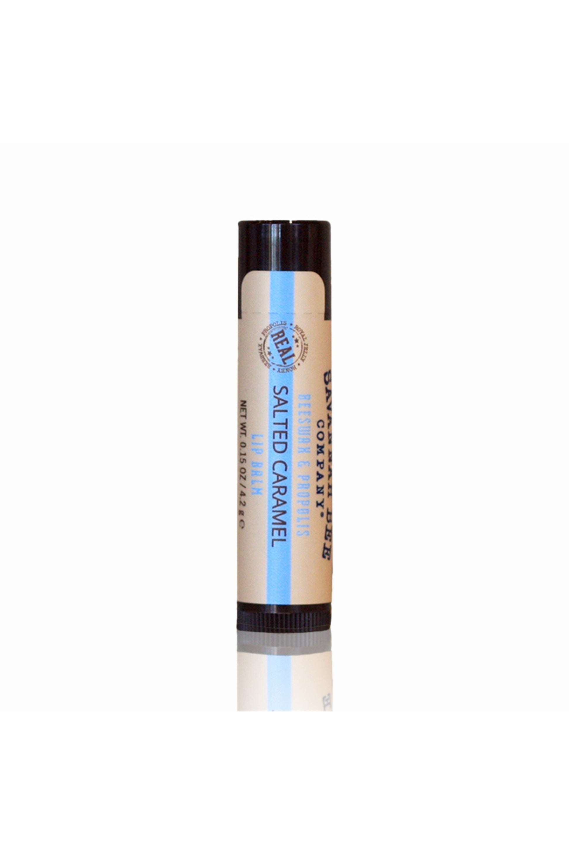Salted Caramel Beeswax & Propolis Lip Balm blue and cream colored lipstick tube.