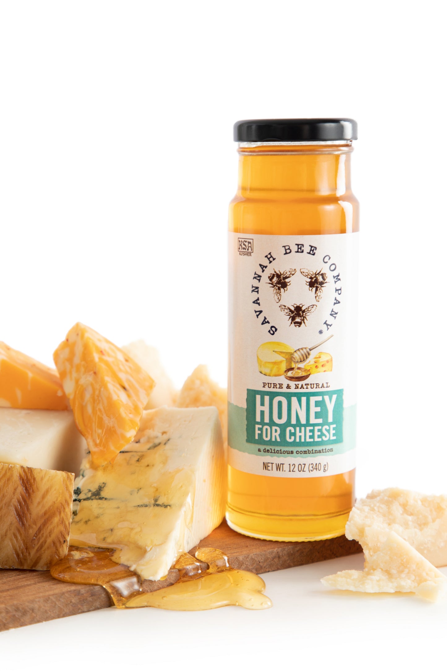 Honey for Cheese, a delicious combination 12 oz. tower  on a board of cheese.