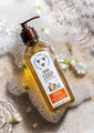 Orange Blossom Hand Soap 9.5 fl. oz. in soapy water with flowers.