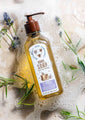 Rosemary Lavender Honey Hand Soap in water with lavender sprigs.