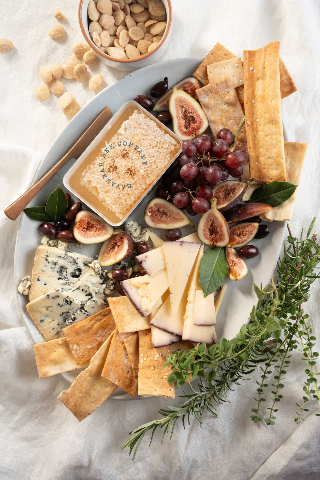 Grazing platter with honeycomb, fruit and cheese.