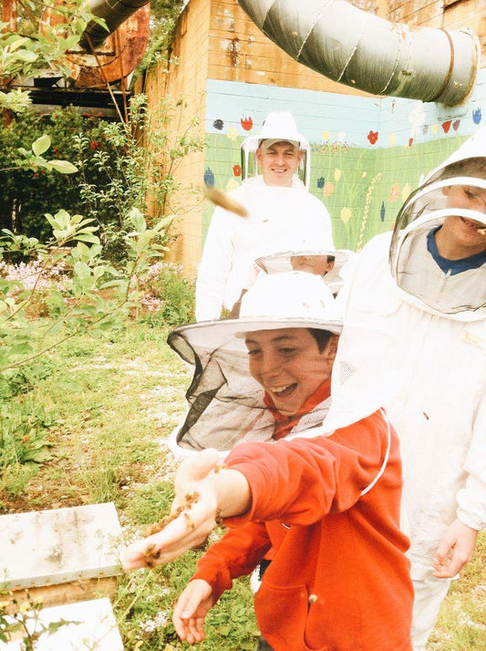 Kids in the bee garden. 