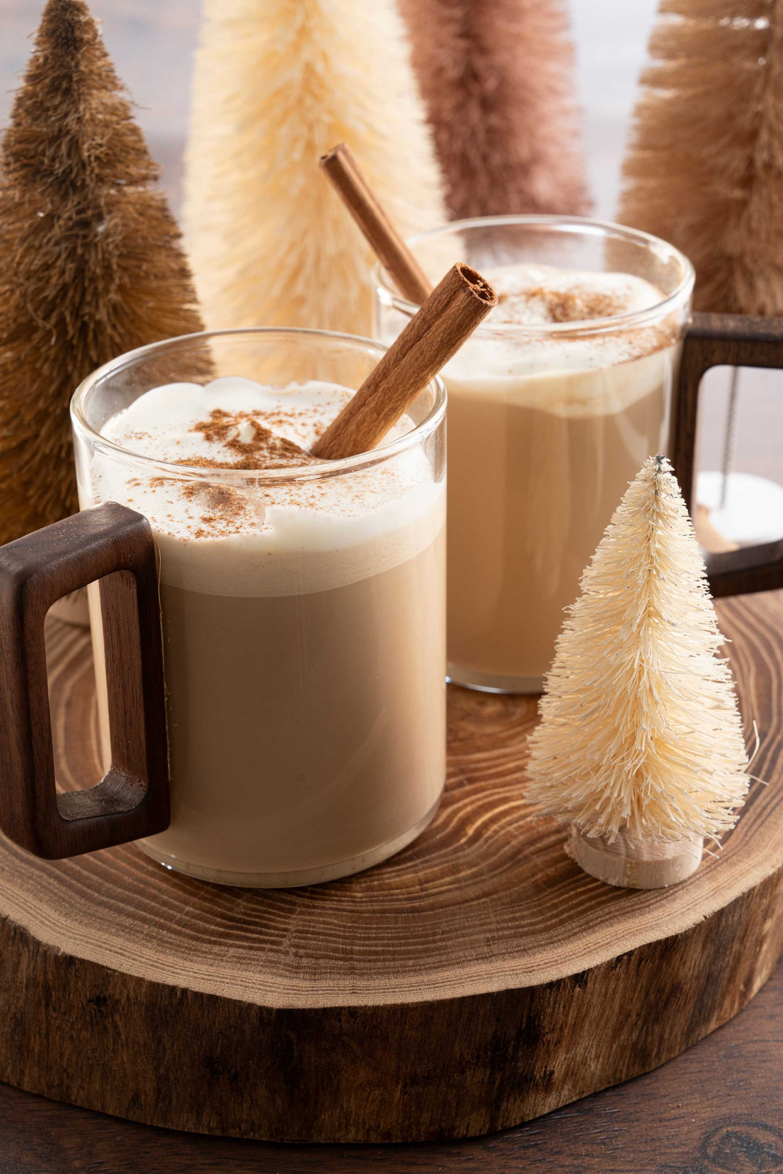 Hot honey cinnamon macchiato with foam and cinnamon sticks.