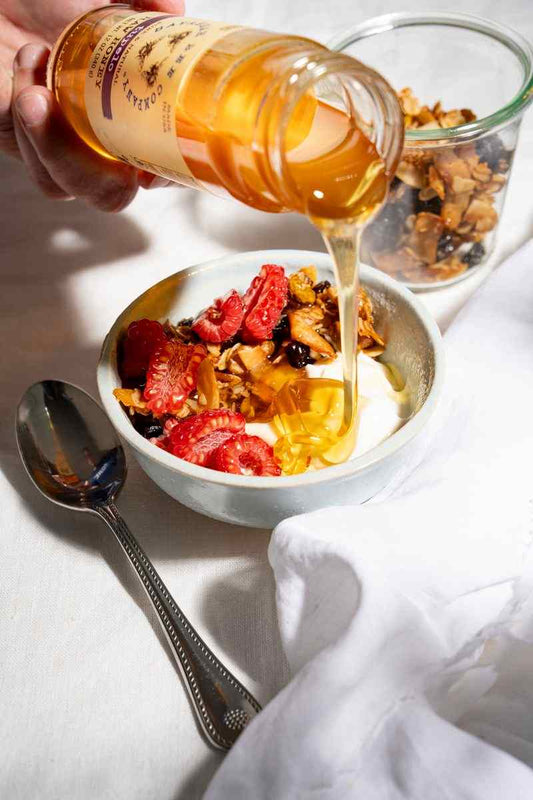 Granola and yogurt with honey.