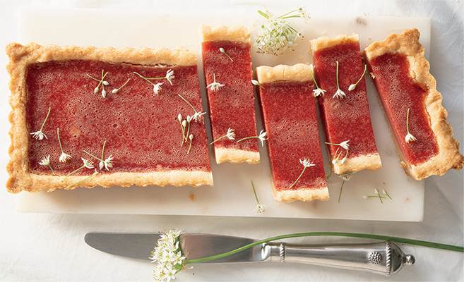Cranberry tart with edible flowers.