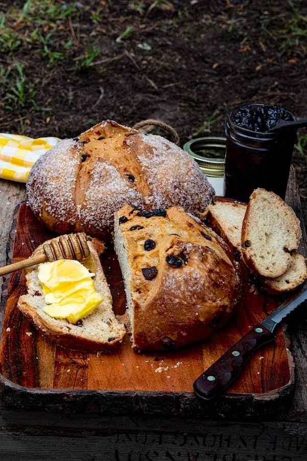 Irish soda bread on a platter with butter.