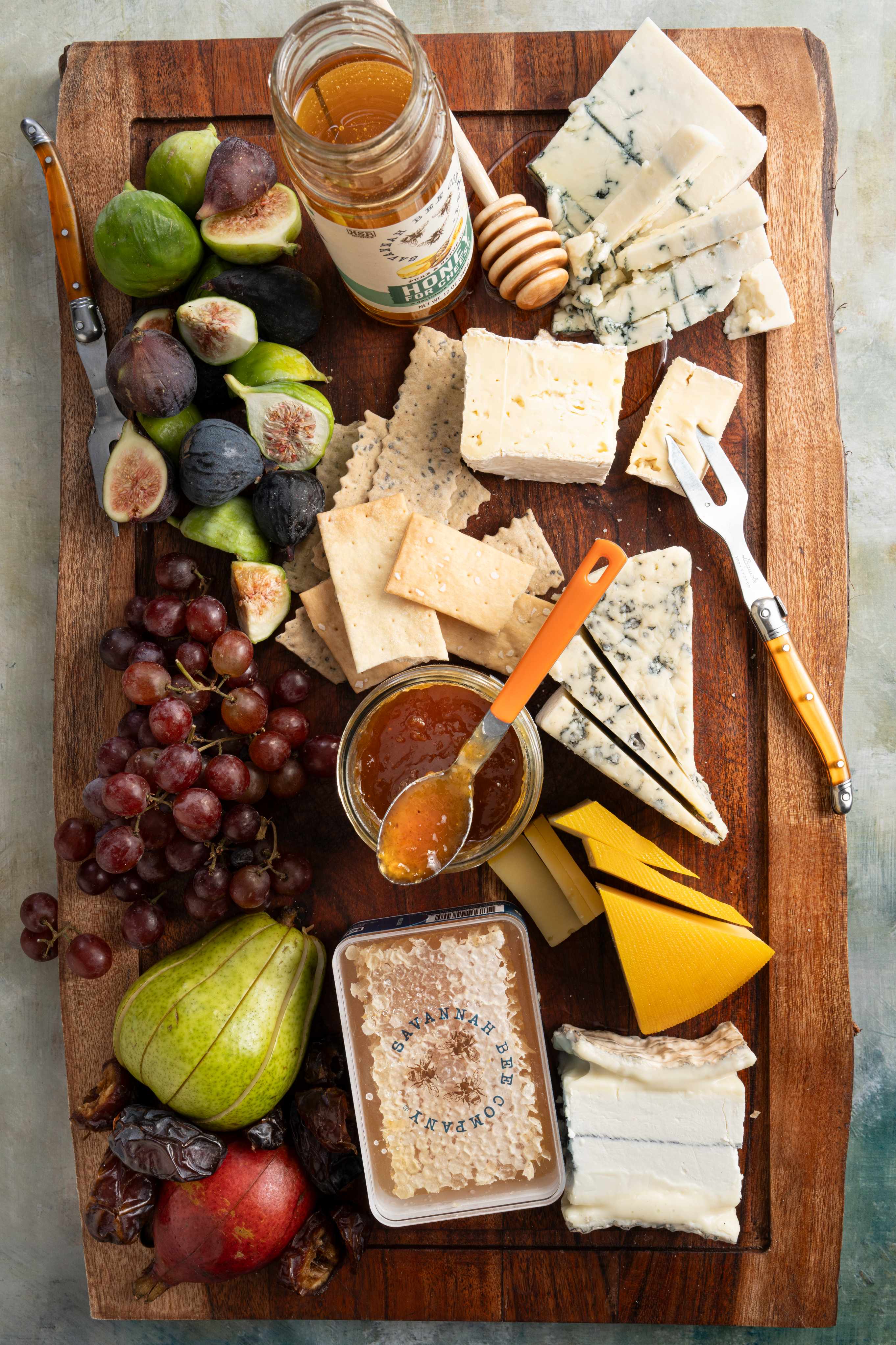 Charcuterie and cheese board with honey