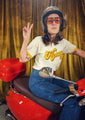 cool-girl-riding-scooter-wearing-groovy-honey-tee-shirt