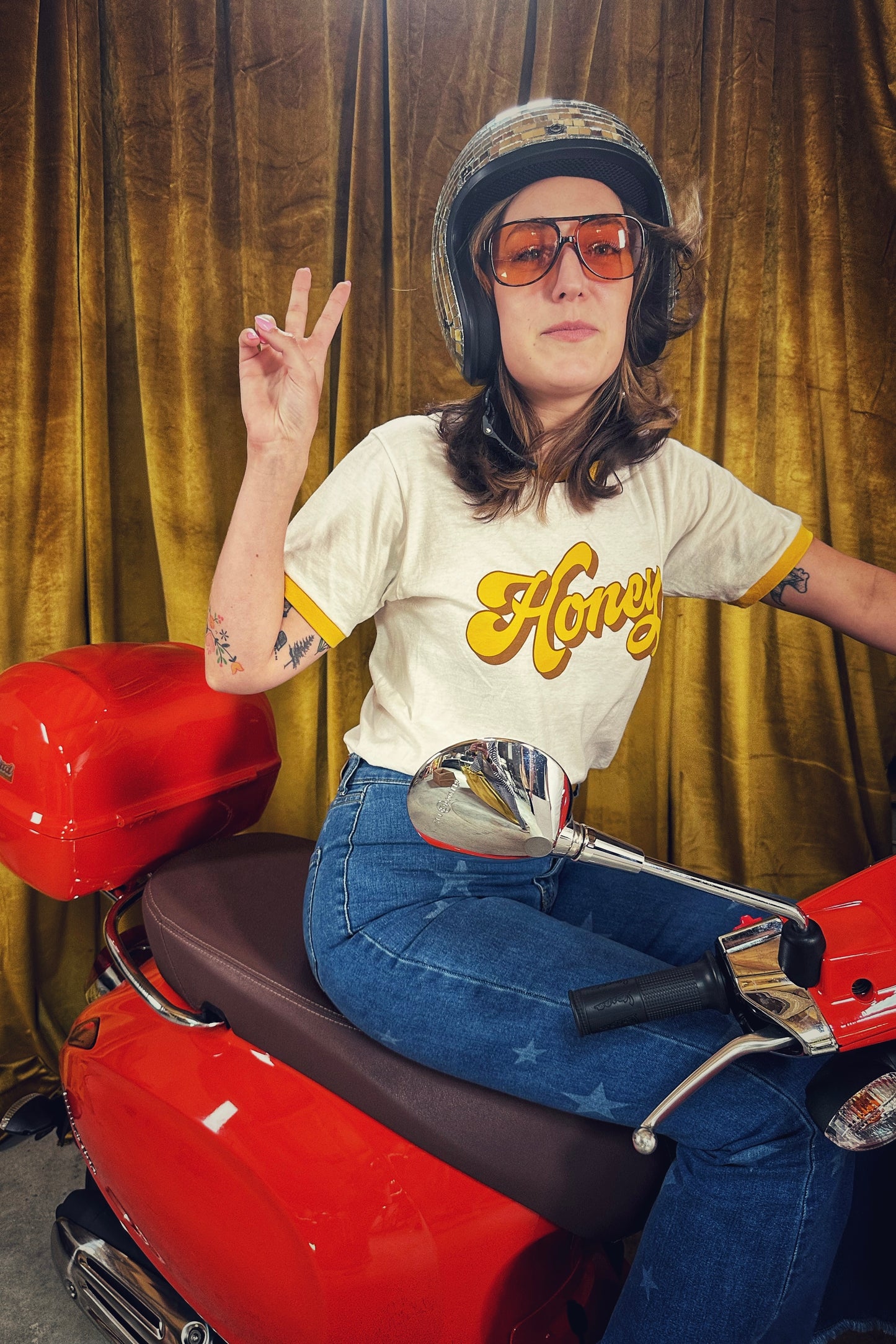 cool-girl-riding-scooter-wearing-groovy-honey-tee-shirt