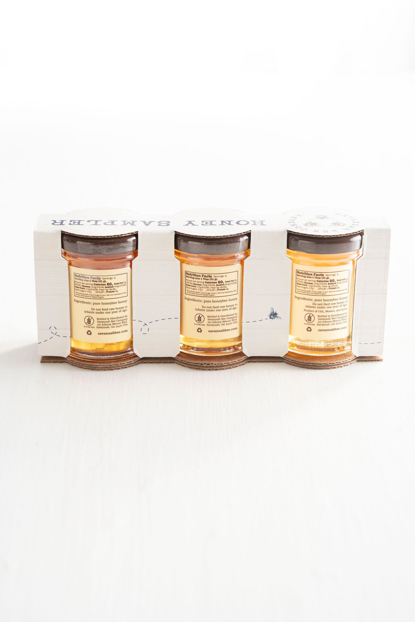The Southern Sample Set includes 3 ounce jars of Georgia Wildflower Honey, Florida Orange Blossom Honey, and Tupelo Honey, back view