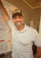 Mark Haney CFO and President of Savannah Bee Company proudly wearing the Bee Box Trucker Hat.