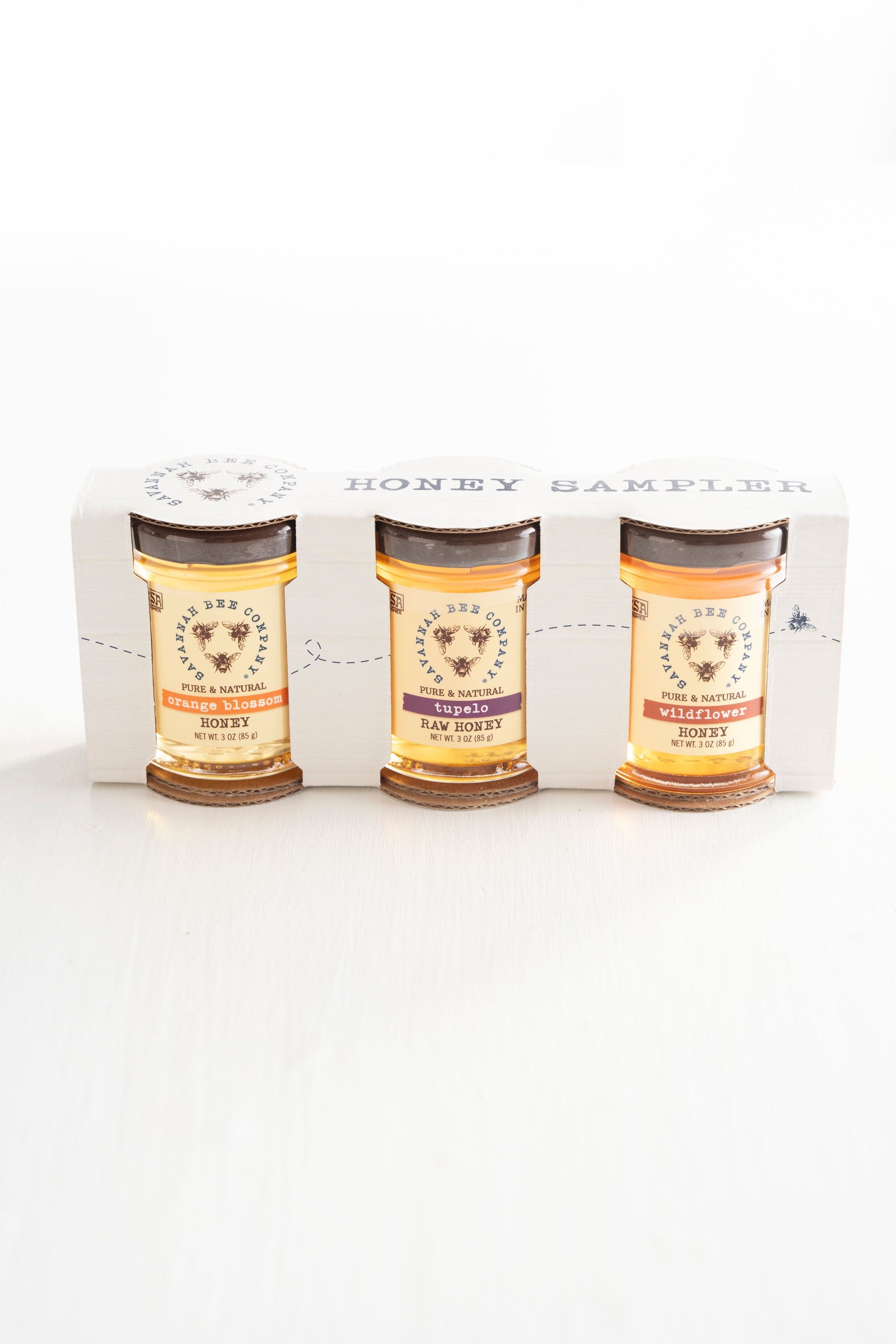 The Southern Sample Set includes 3 ounce jars of Georgia Wildflower Honey, Florida Orange Blossom Honey, and Tupelo Honey.