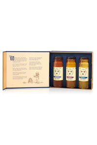 Book of honey gift set opened to 12 ounce lavender, tupelo and acacia honey jars.