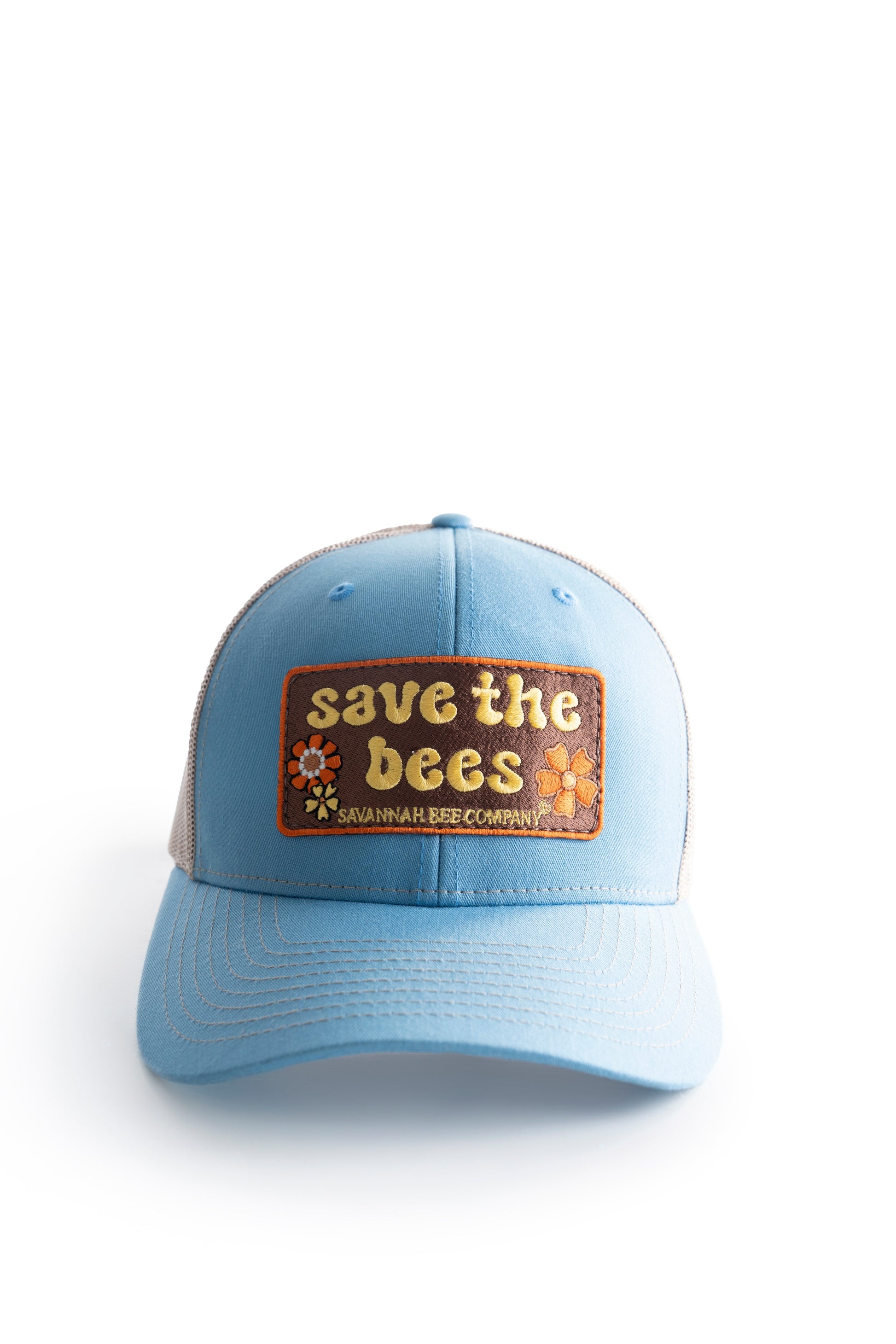 Blue save the bees trucker hat with groovy font facing front