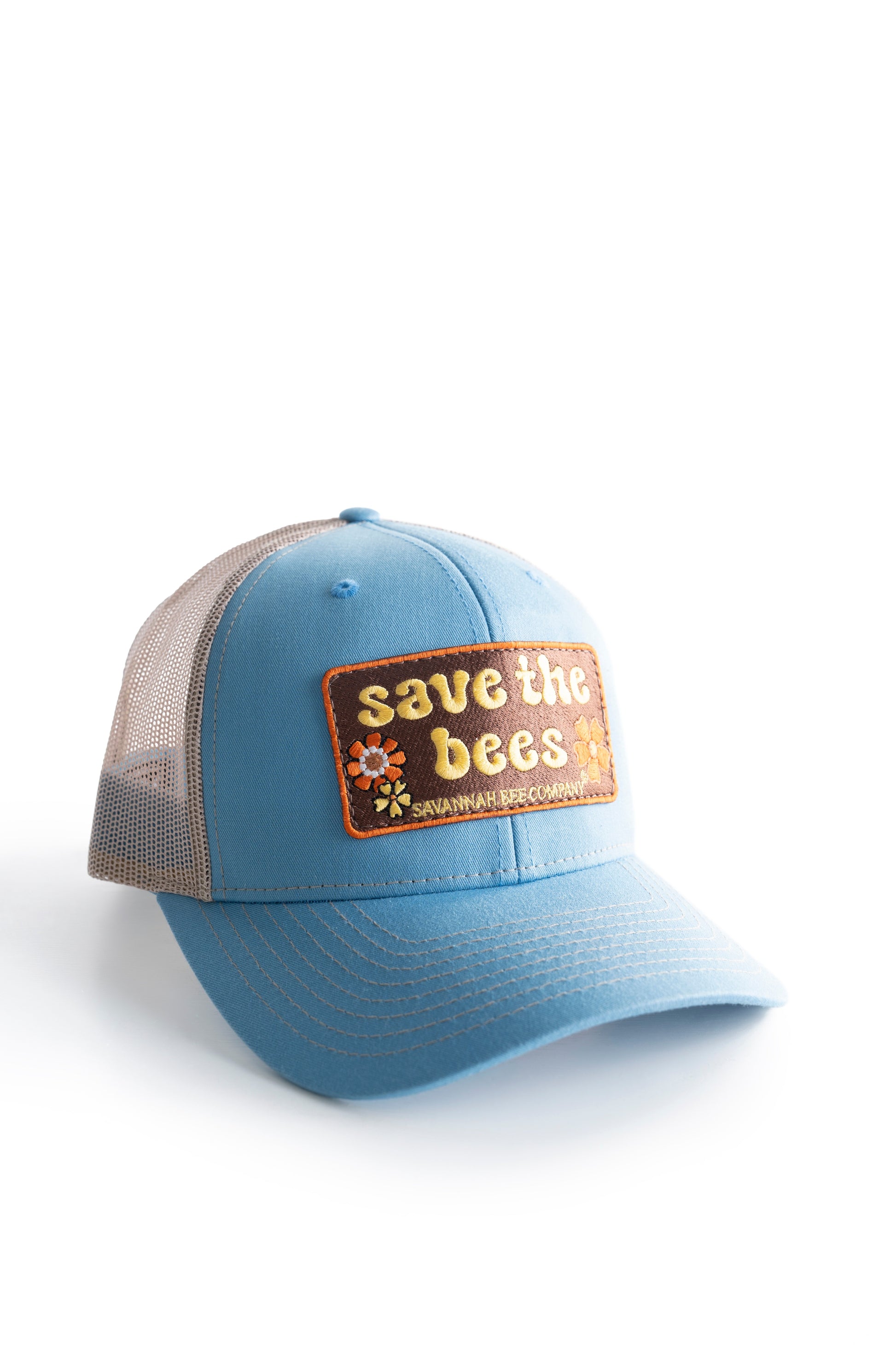 Blue save the bees trucker hat with groovy font facing right
