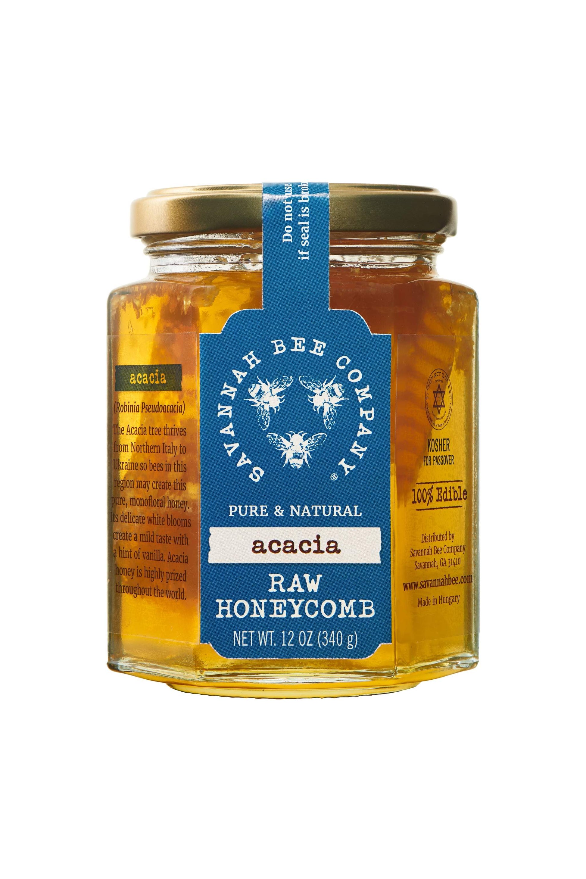 Pure & Natural Acacia Raw Honeycomb 12 oz. jar  with a golden lid.