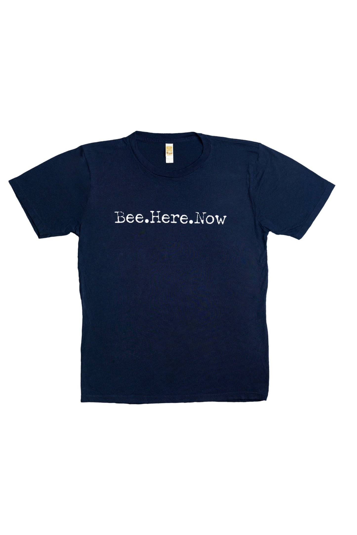 Short sleeve, navy, crew neck thsirt. Front of the shirt has the saying Bee Here Now in white lettering. 