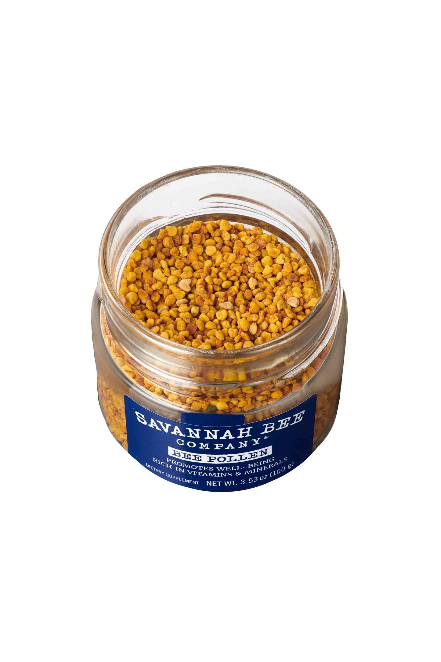 Pure & Natural Savannah Bee Company Bee Pollen 3.53. oz. Lid unscrewed with a ariel shot of bee pollen.
