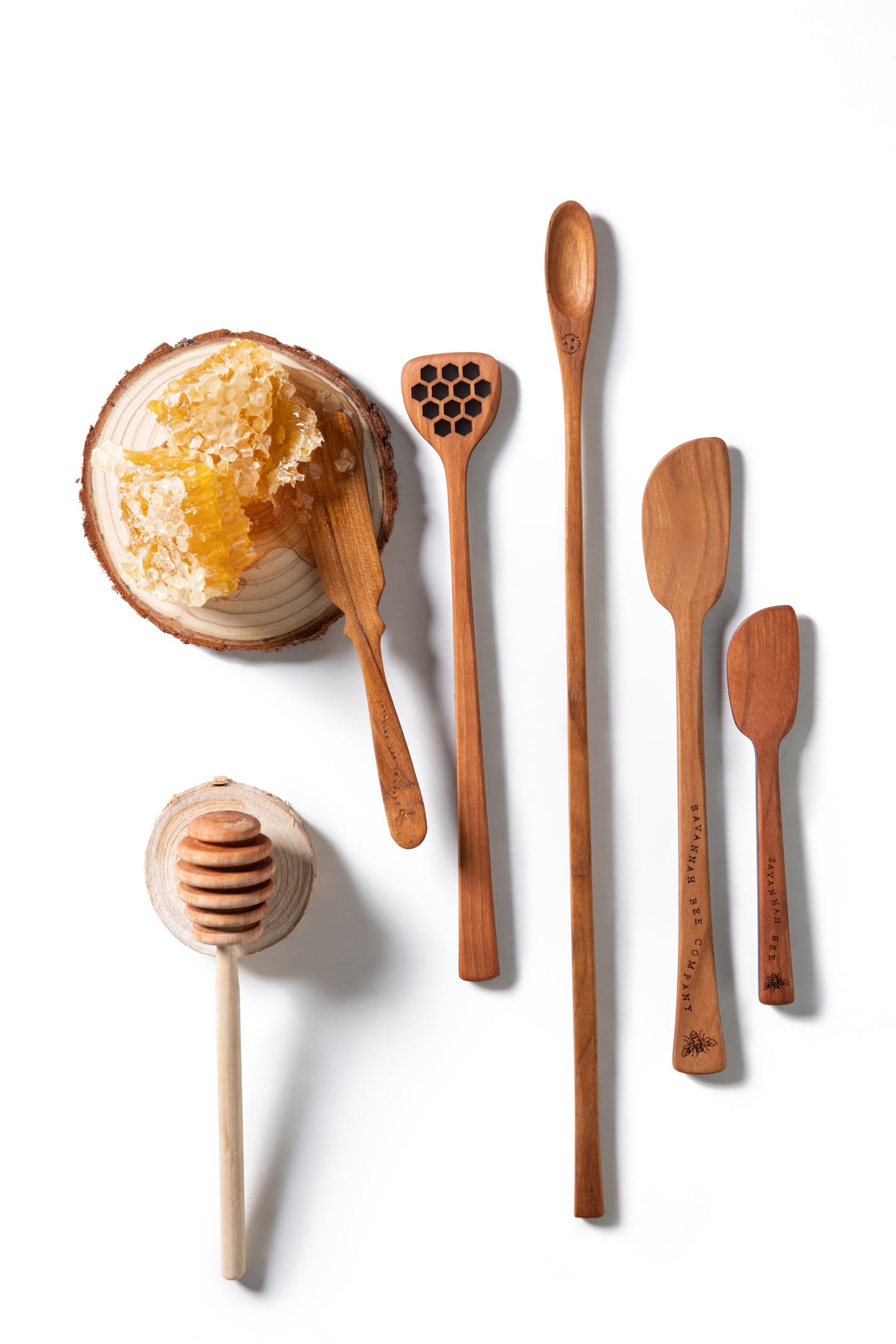 Honey tool collection with small honeycomb.
