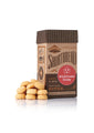 Package of wildflower honey shortbread cookies next to a stack of small round shortbread cookie bites studio image