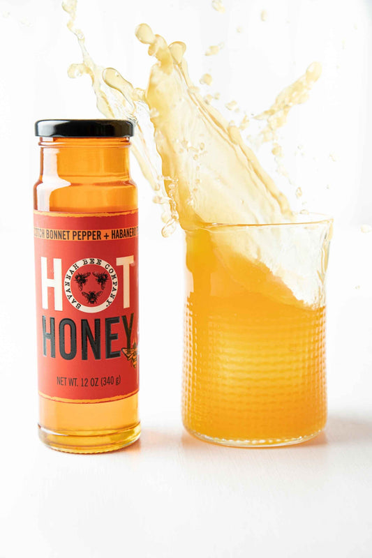 Scotch Bonnet and Habanero Peppers Hot Honey 12 oz. tower