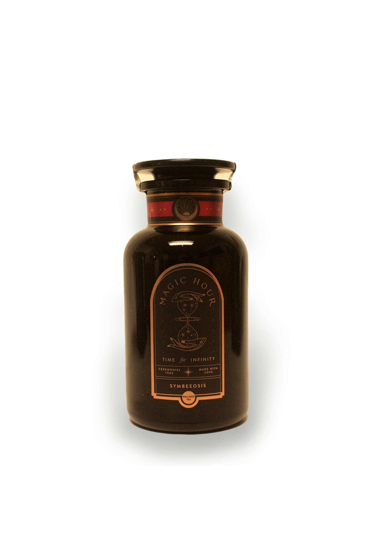 The tea comes in an exquisite violet glass bottle designed to keep the tea fresh studio image